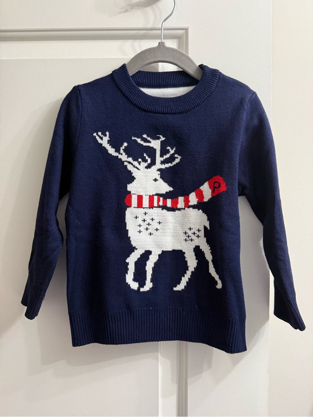Navy Reindeer Knit Sweater with Red Scarf Detail